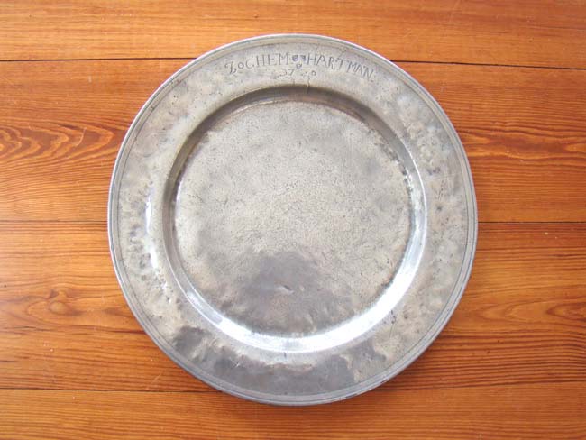 An early 18th century Pewter charger inscribed "Jochem Hartman 1720."
